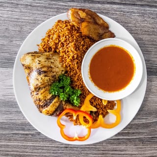 Jollof Rice with Fried Chicken Leg Quarters